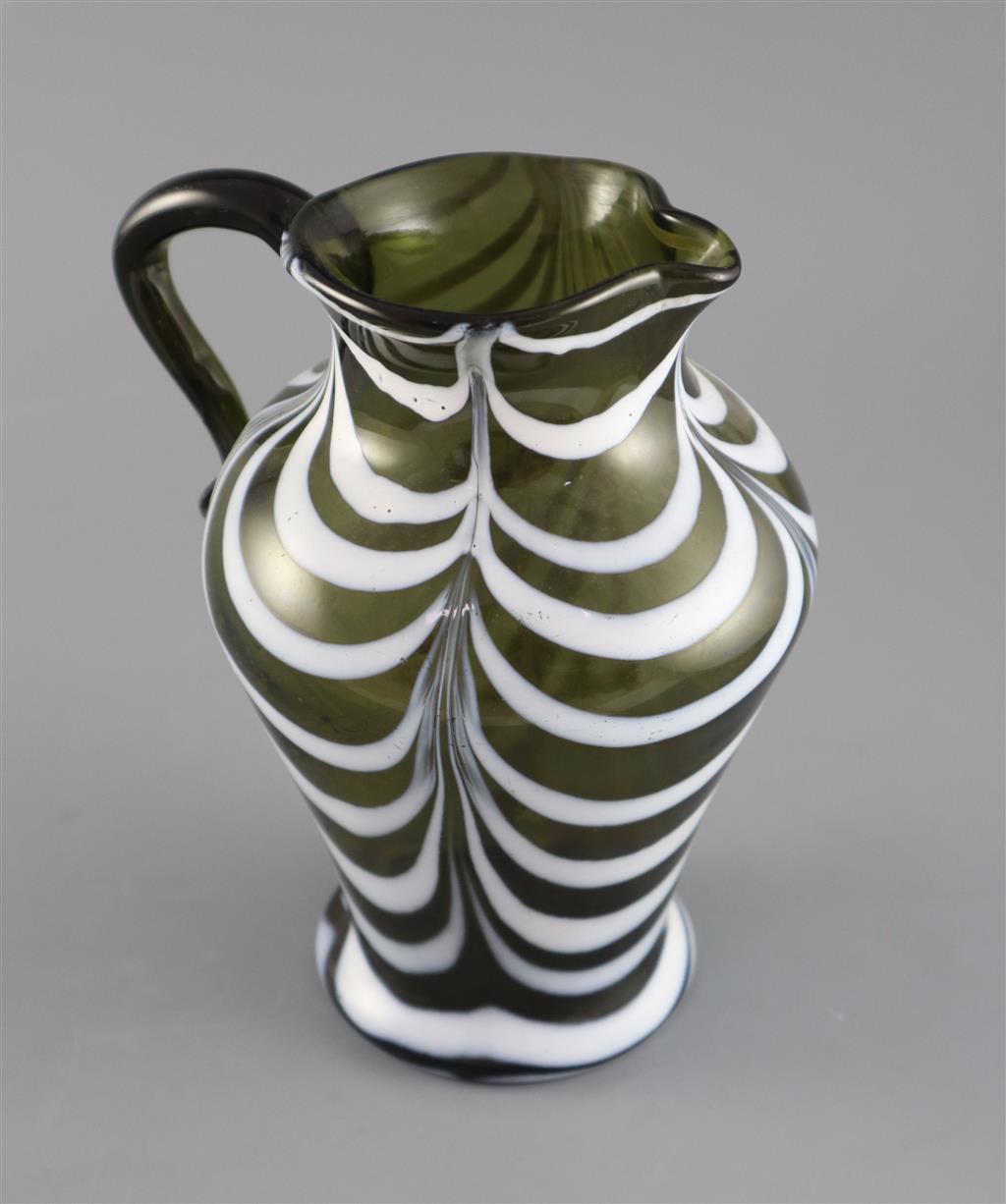 A George III green and white feather trailed glass jug, c.1800, 19cm high